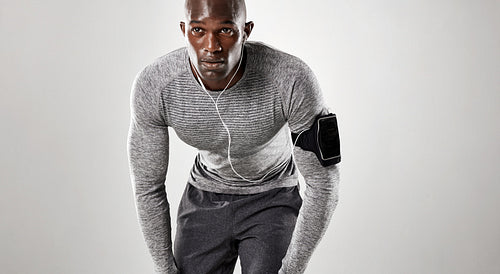 Focused young man ready for running 