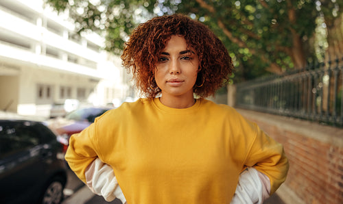 Self-confident teenage girl looking at the camera