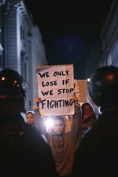 Group of demonstrators in front of police force