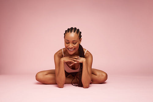 Beautiful woman sitting with hand on chin