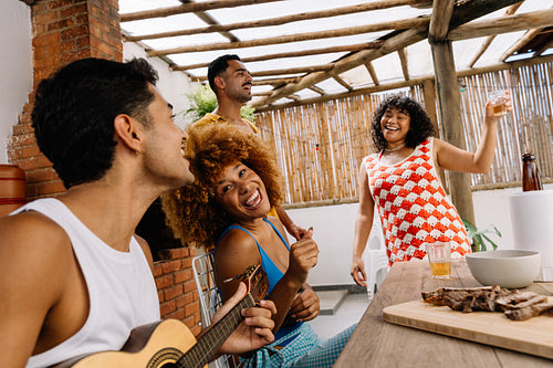 Group of friends enjoying samba music and food in Rio de Janeiro