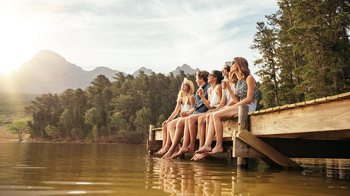 Friends hanging out at the lake