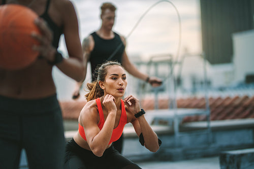Fitness man and women training on rooftop