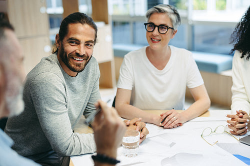 Happy design professionals having a meeting in an office