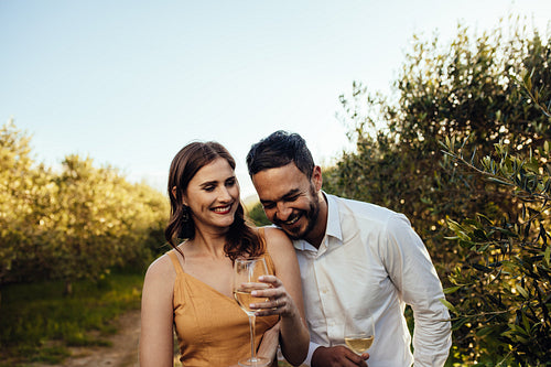 Romantic couple walking in a wine farm
