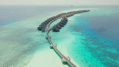 Stunning Aerial View of Luxury Overwater Bungalow Resort in Tropical Island Paradise Maldives