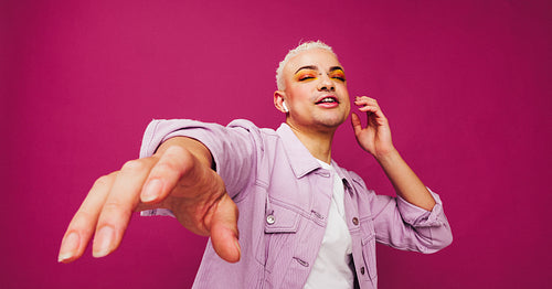 Gender non-conforming man enjoying his favourite song