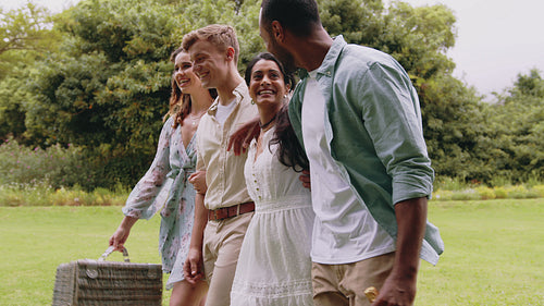 Cheerful friends at park for picnic