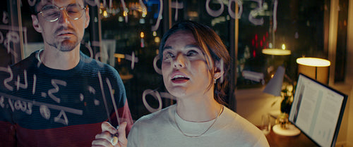 Young business team working late on project equations