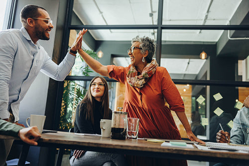 Cheerful business colleagues celebrating their success