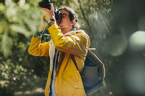 Traveler capturing the beauty of nature in a camera