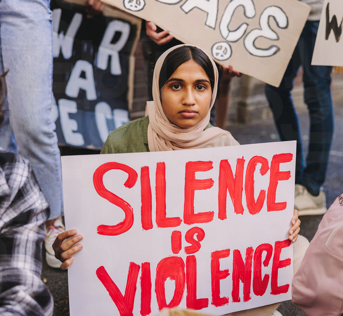 Muslim girl holding an anti-violence poster – Jacob Lund Photography ...