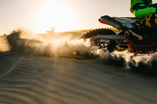 Dirt bike skidding in desert