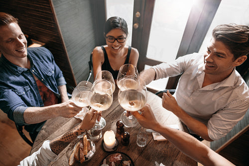 Group of people enjoying a glass of wine at cafe