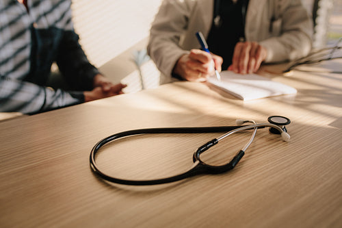 Doctor prescribing drug to her patient