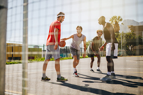 Men playing basketball