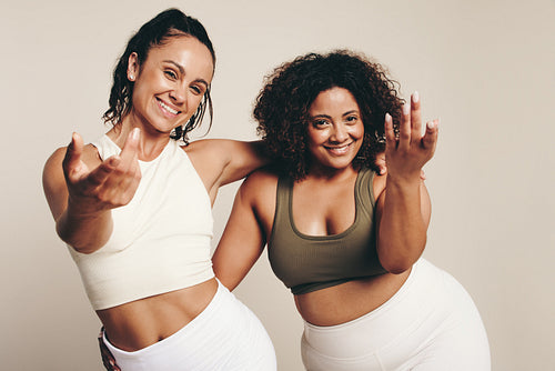Fitness fun: Two energetic women in sports clothing embracing a healthy lifestyle