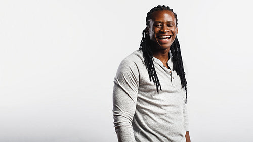 Cheerful african man with dreadlocks