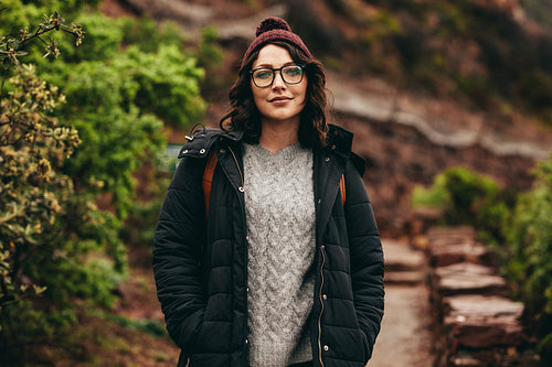 Female tourist standing on hill steps