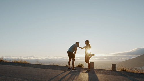 Couple taking a break after a morning run