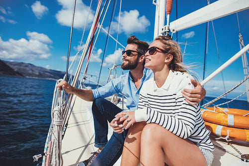 Loving young couple having vacation on a yacht