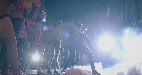 Violent activist throwing a smoke grenade