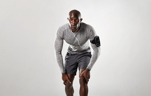 Fit young man on his mark to start running