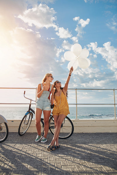 Best friends enjoying a day on seaside promenade