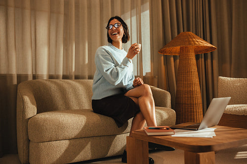 Professional woman working comfortably with laptop in office