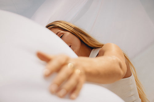 Young woman with flowing hair enjoying a peaceful moment outdoors