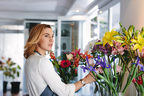 Woman working in retail flower shop