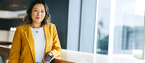 Female entrepreneur looking at the camera in an office