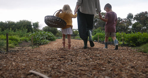 Mother going harvesting with her kids