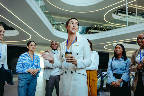 Manager welcoming new recruits at a modern accounting firm