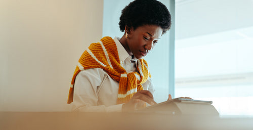 African woman working on a tablet
