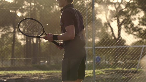 Professional tennis player playing on hard court