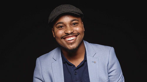 Portrait of a happy man in cap