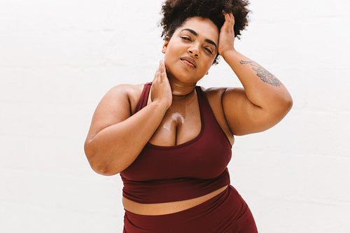 Body positive woman relaxing after workout