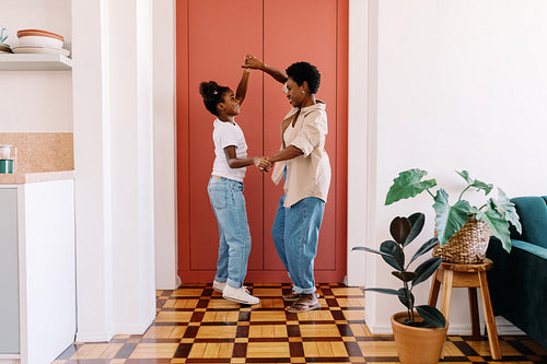 Young girl dancing with her home at home