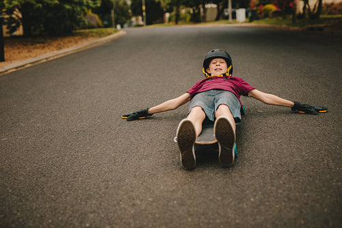 Playful boy skateboarding