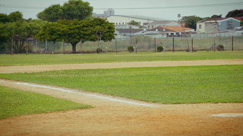 Baseball player slides into base during game