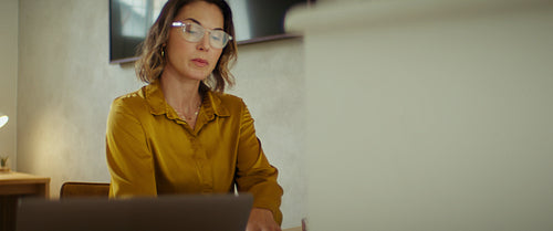Focused businesswoman working at her desk in a modern office