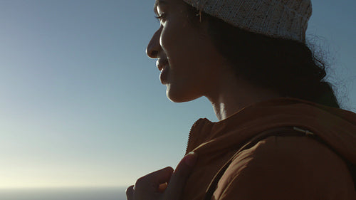 African girl hiker looking around