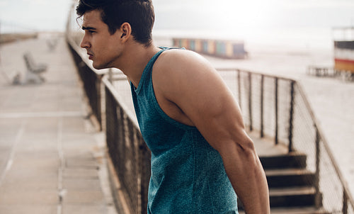 Fit young man standing outdoors