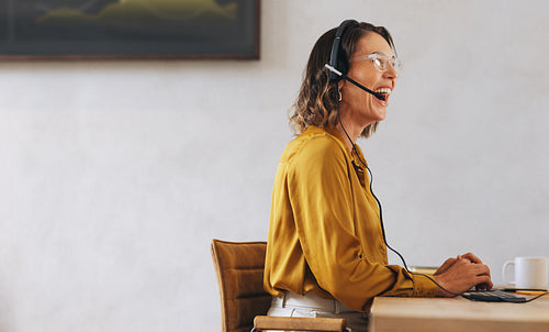 Call center employee managing call operations in a travel agency