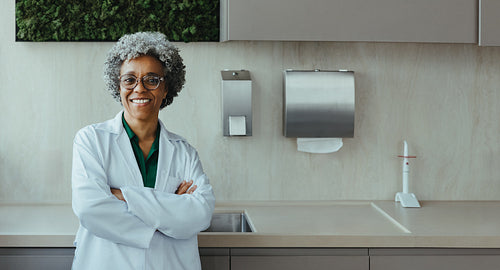 Friendly dentist portrait in a modern dental clinic