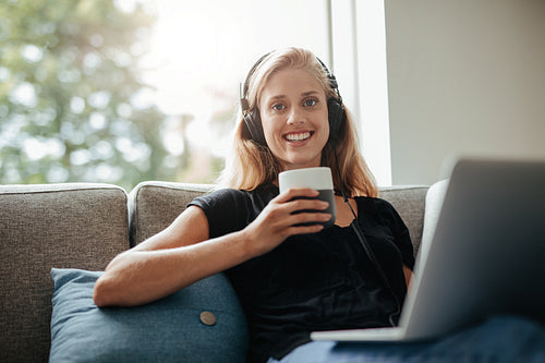 Smiling woman relaxing in living room