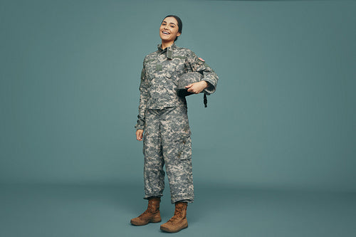 United States servicewoman smiling happily in a studio