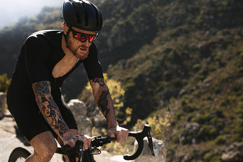 Strong cyclist training outdoors