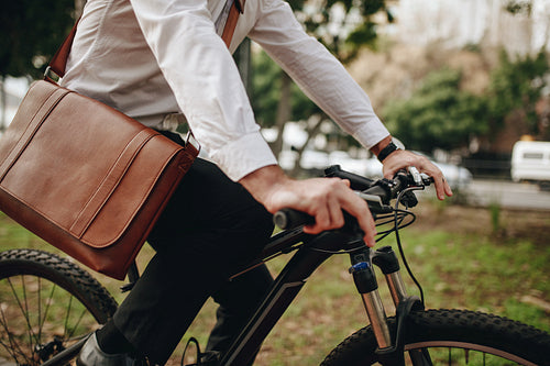 Man commuting to office on bicycle